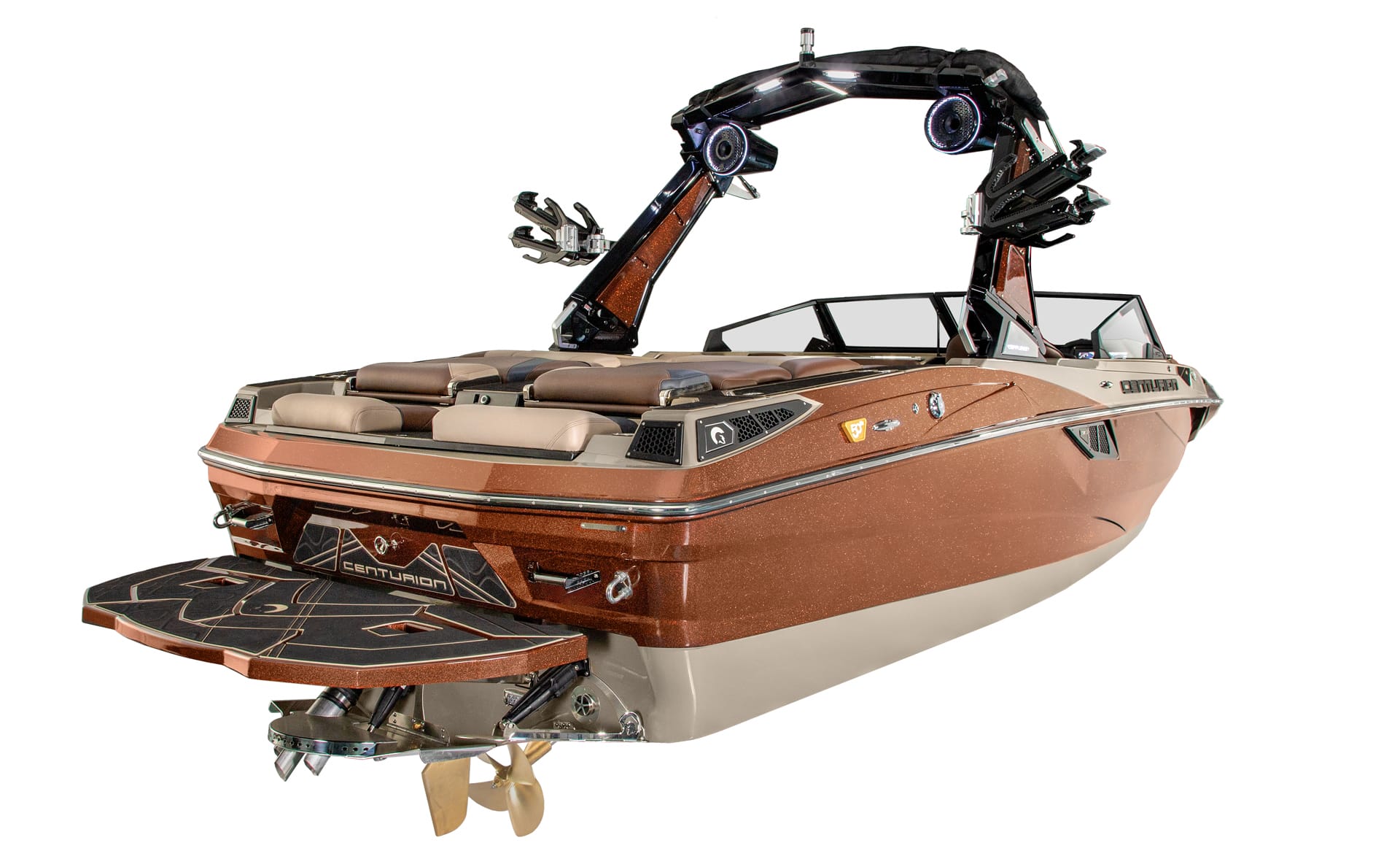A brown and beige Centurion Fi23 wakeboard boat with a tower, speakers, and swim platform, shown from the rear at an angle on a white background.