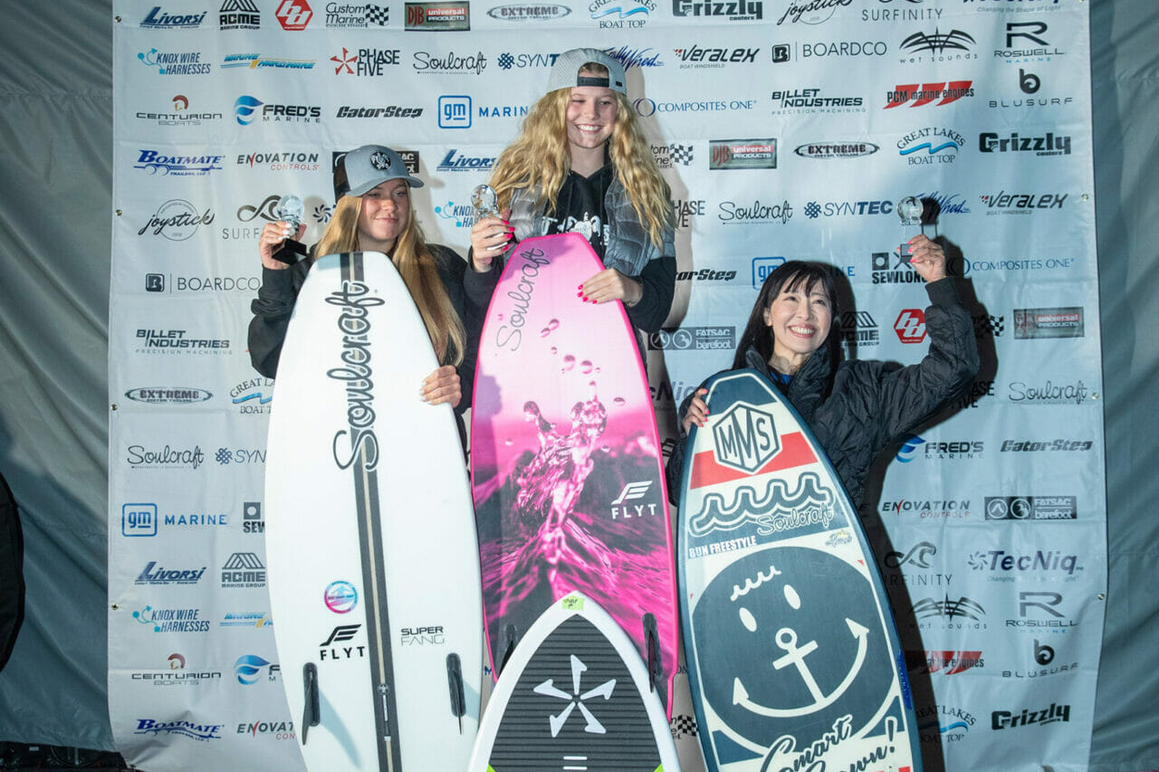 A group of people posing with their surfboards during the 2024 WWSC Day 2 Recap.