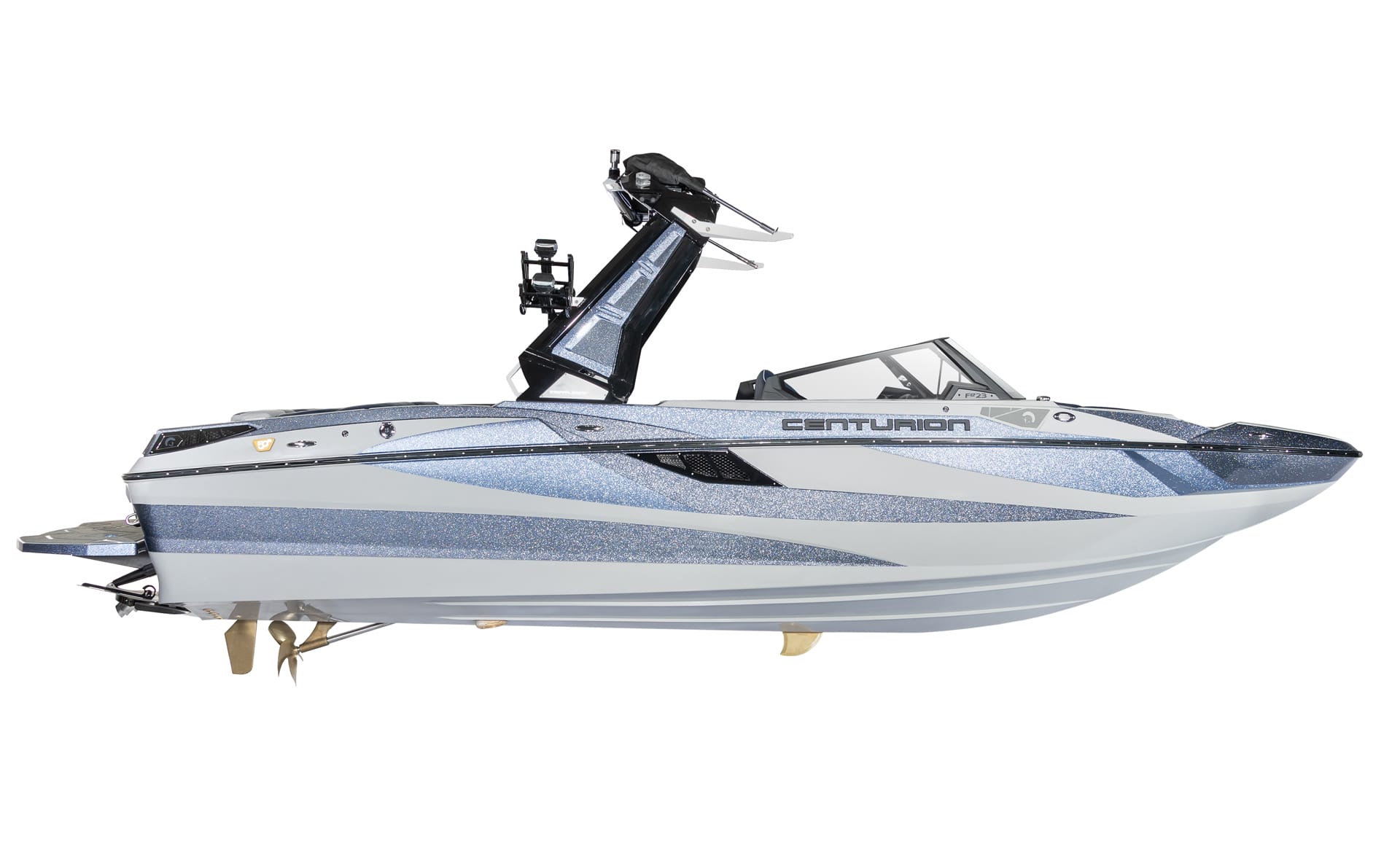 Side view of a modern Centurion Fe22 Surf Boat with a blue and white glitter finish, tower, and open bow design.