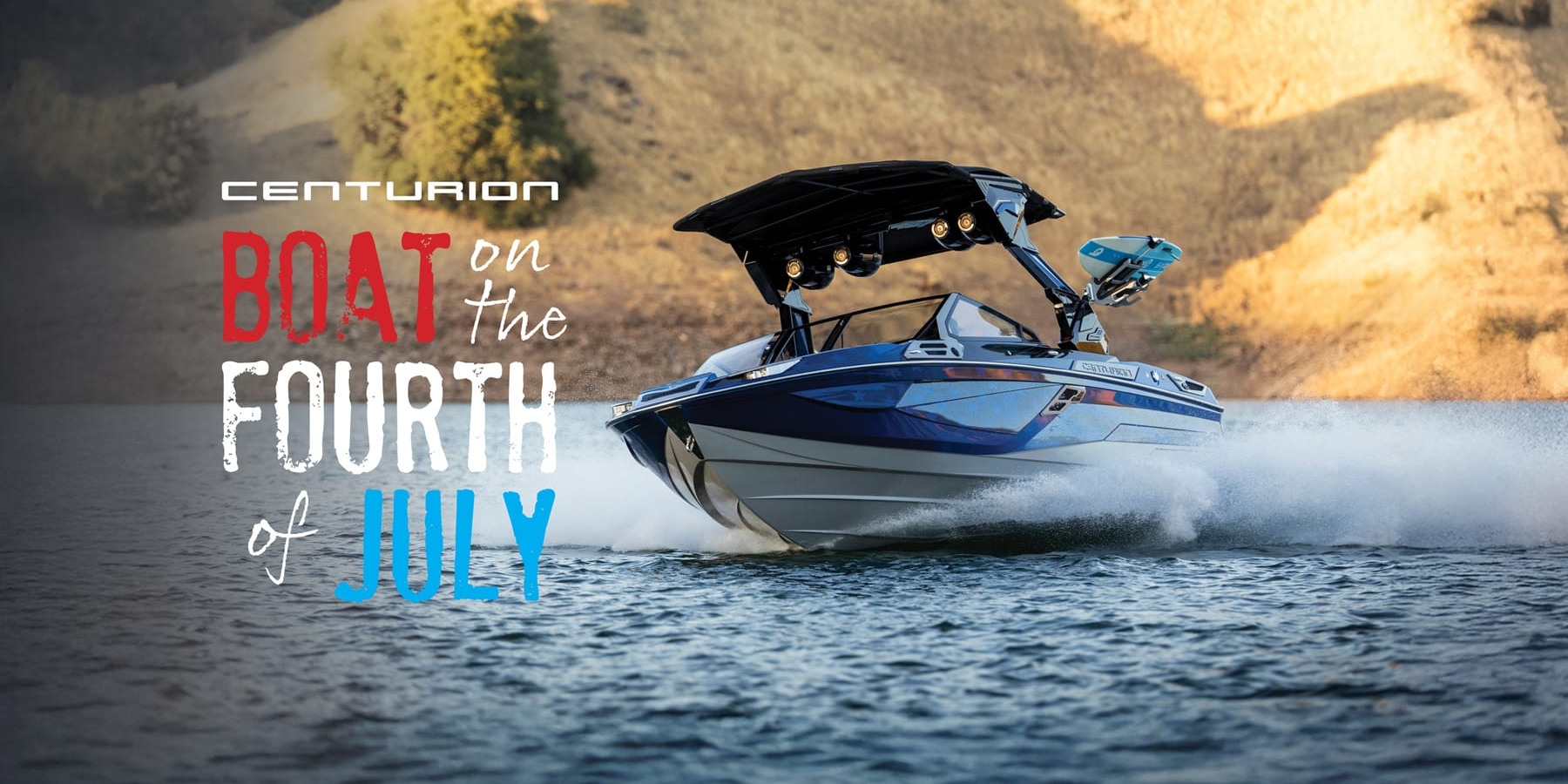 A blue and white speedboat moves quickly across a lake with hills in the background. Text reads, 