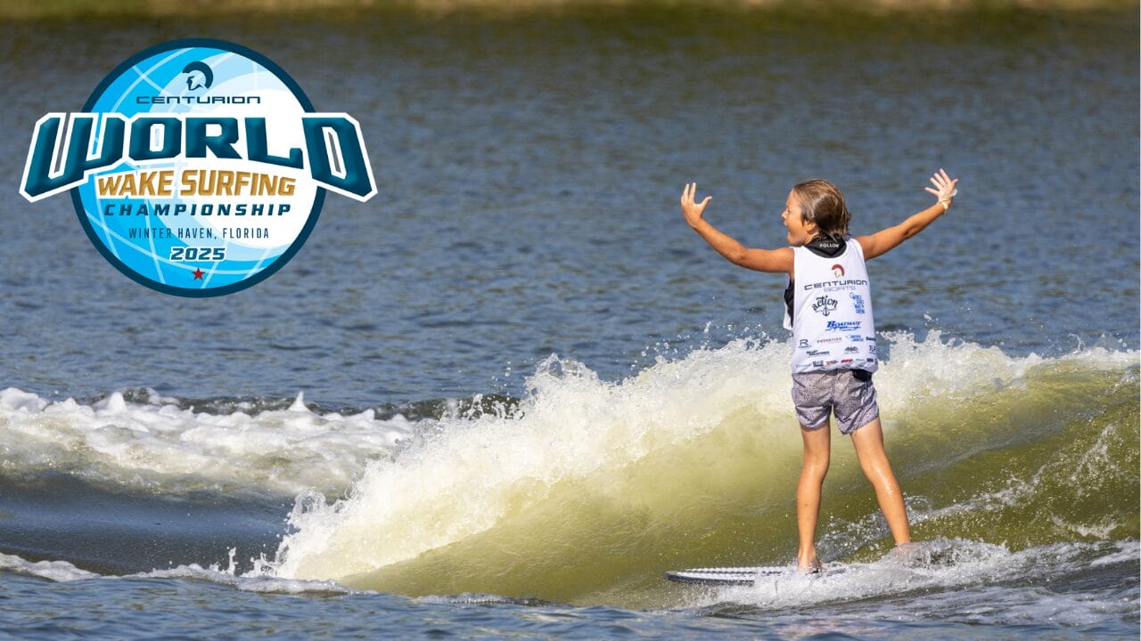 A young surfer rides a wake on a lake, arms raised, wearing a competition jersey. The Centurion World Wake Surfing Championship 2025 logo is displayed on the left.