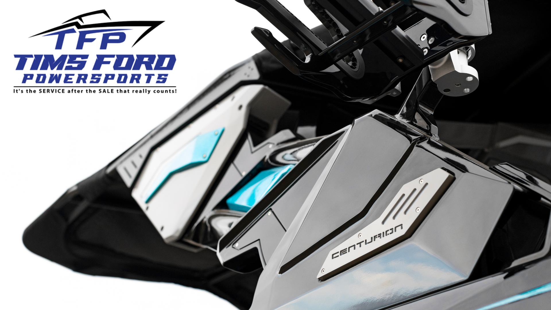 Close-up of a Centurion boat detail, with the Tims Ford Powersports logo and slogan in the top left corner.